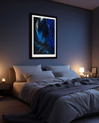 Modern bedroom with a large bed, nightstands, and a cityscape view.